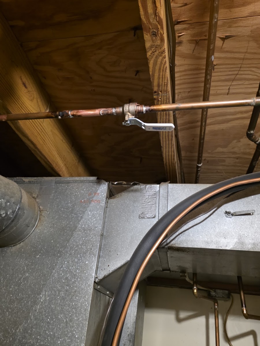 Copper refrigerant line and ductwork installed in an attic